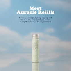 Dieux Auracle Eye Serum Refill on a blue and white cloud background,
Text: Meet Auracle Refills. Reuse your original pump and cap and insert it into your new refill bottle. Savings for you and the environment.