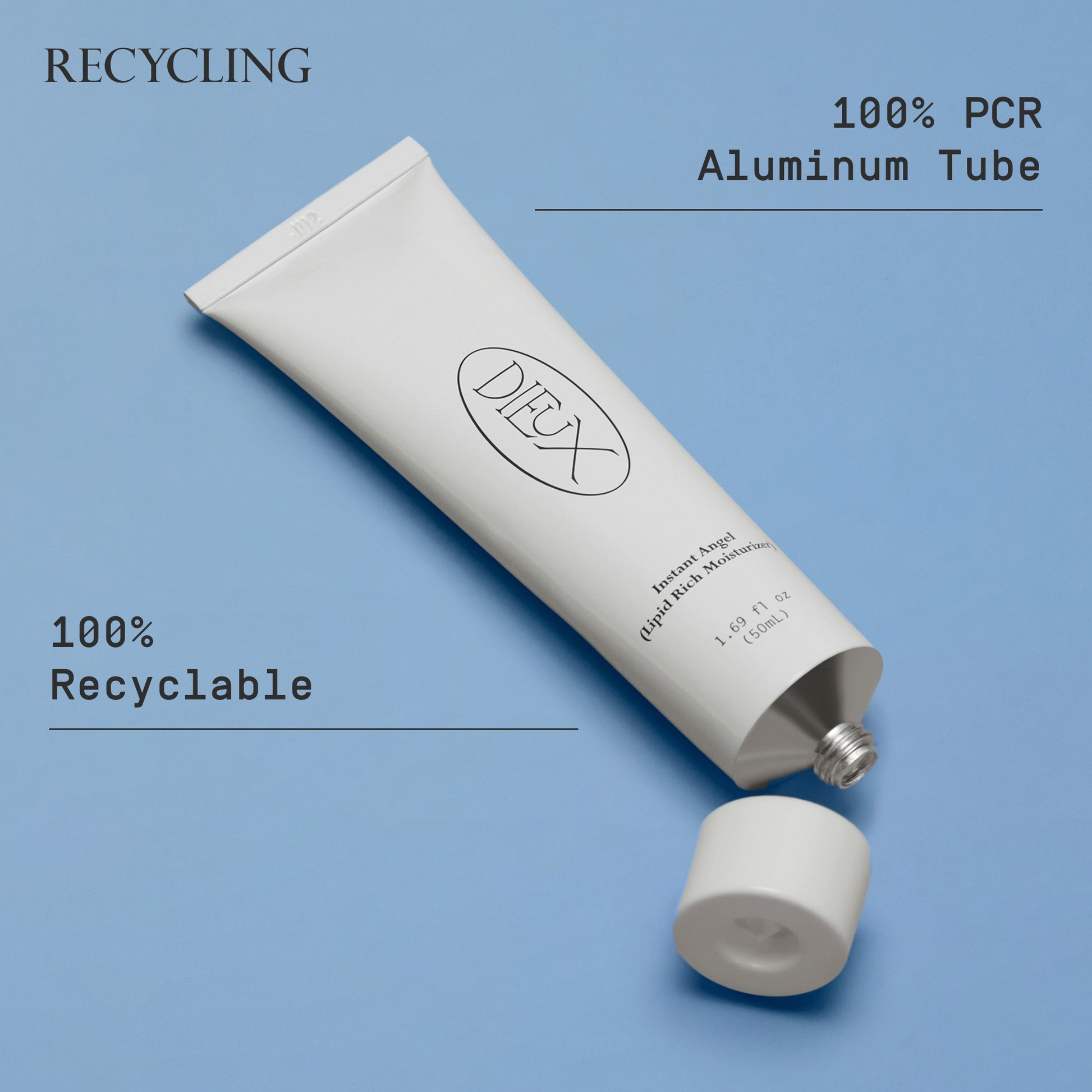 Image: Dieux Instant Angel Firming Moisturizer bottle on a light blue background.
Text: Recycling. 100% PCR aluminum tube. 100% recyclable.