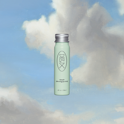 Dieux Auracle Eye Serum Refill on a blue and white cloud background.