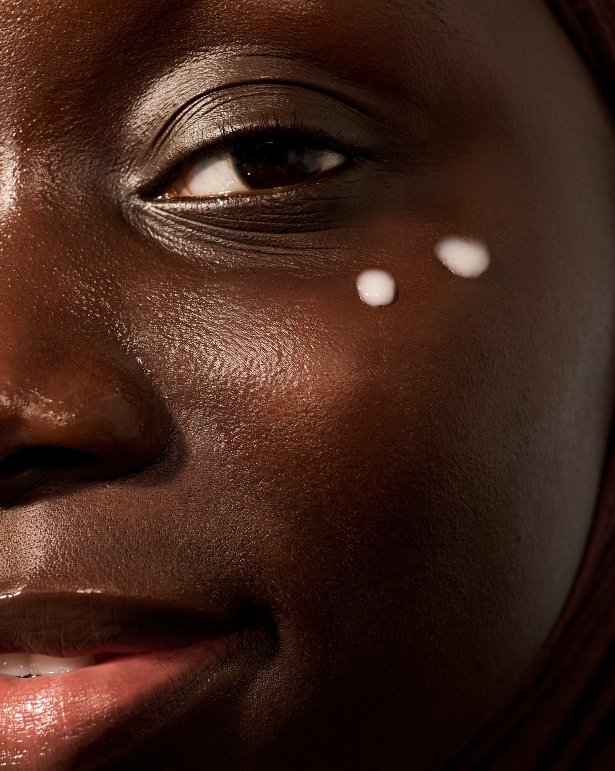 Auracle Eye Serum applied as dots under the eye