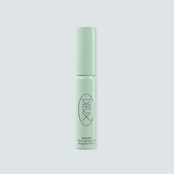 Dieux Auracle Eye Serum bottle on a pale blue background