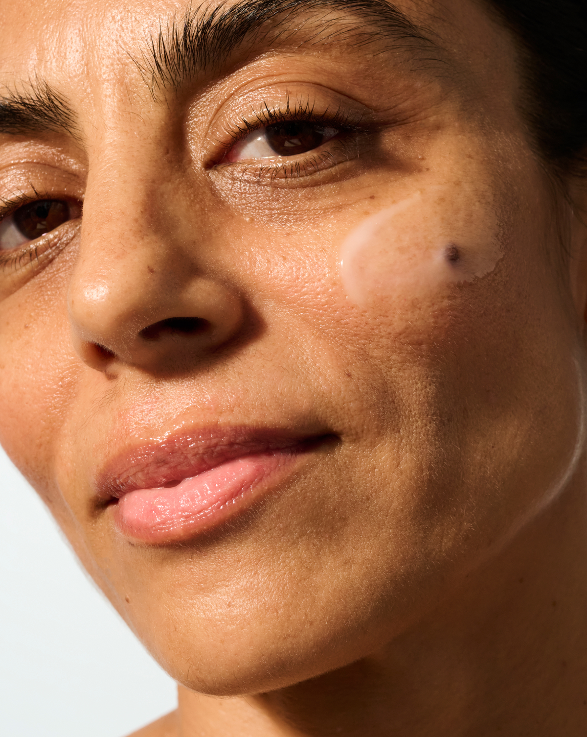Close-up portrait with glowing skin for Deliverance serum