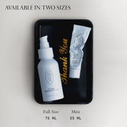Image: Both sizes (75ml and 25ml) of Dieux Air Angel Gel Cream lying flat on a small black tray that says "Thank You" in gold lettering. 

Text: Available in two sizes. Full-Size 75ml. Mini 25ml.