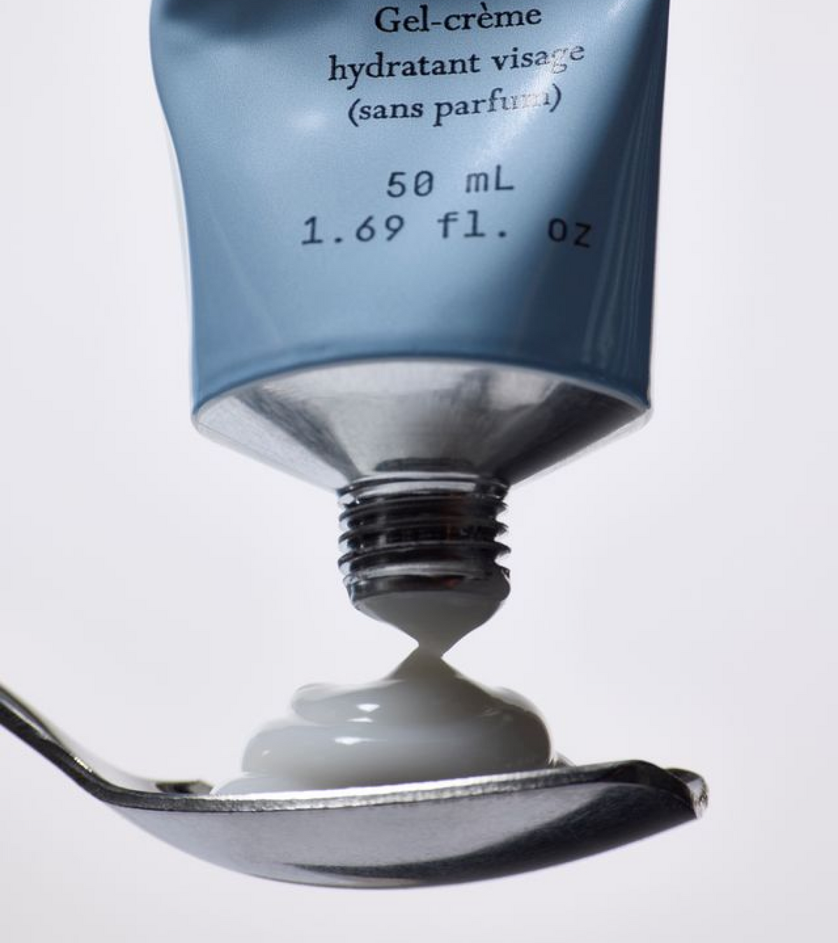 dieux Dieux-air-angel-peptide-plumping-gel-cream-squeeze-tube-dispensing-onto-spoon.